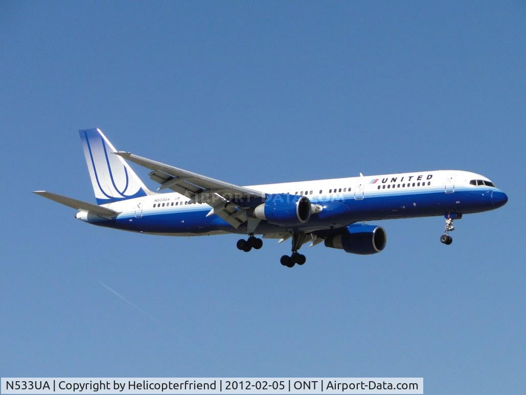 N533UA, 1991 Boeing 757-222 C/N 25073, On final to runway 8L, passing the outer fence.