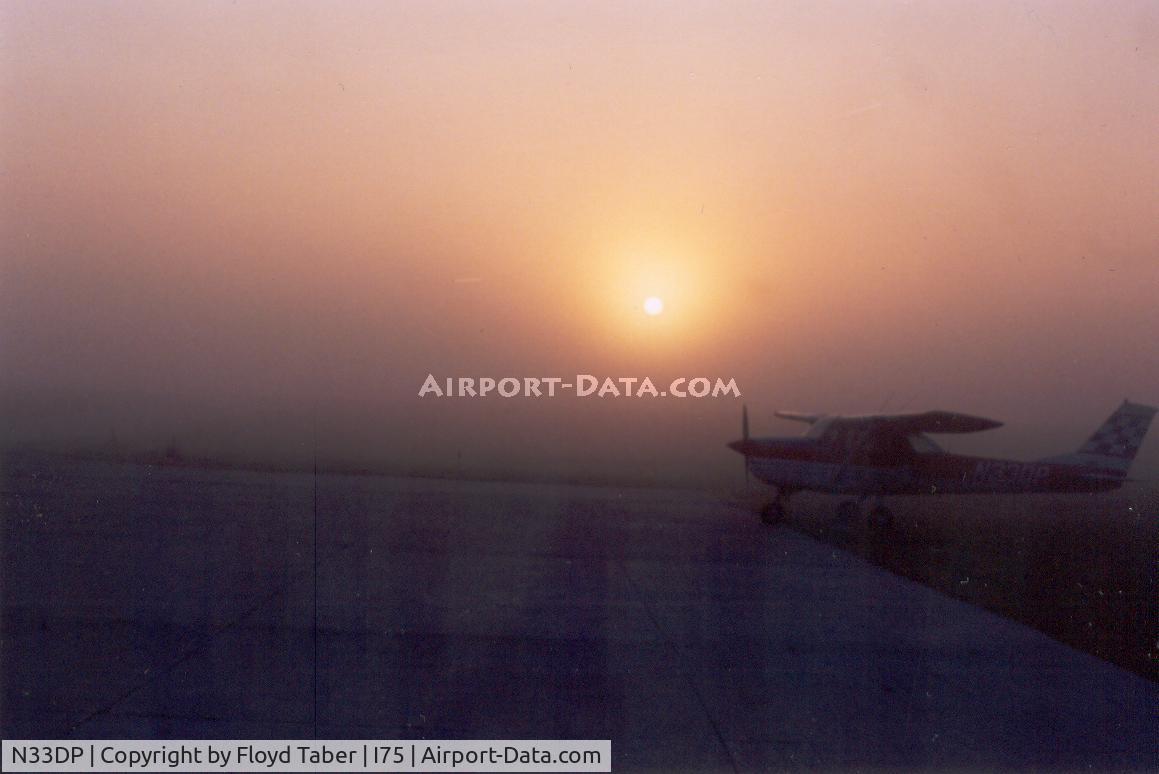 N33DP, 1967 Cessna 150G C/N 15066465, N33DP silhouetted against a rising sun on a foggy Saturday morning