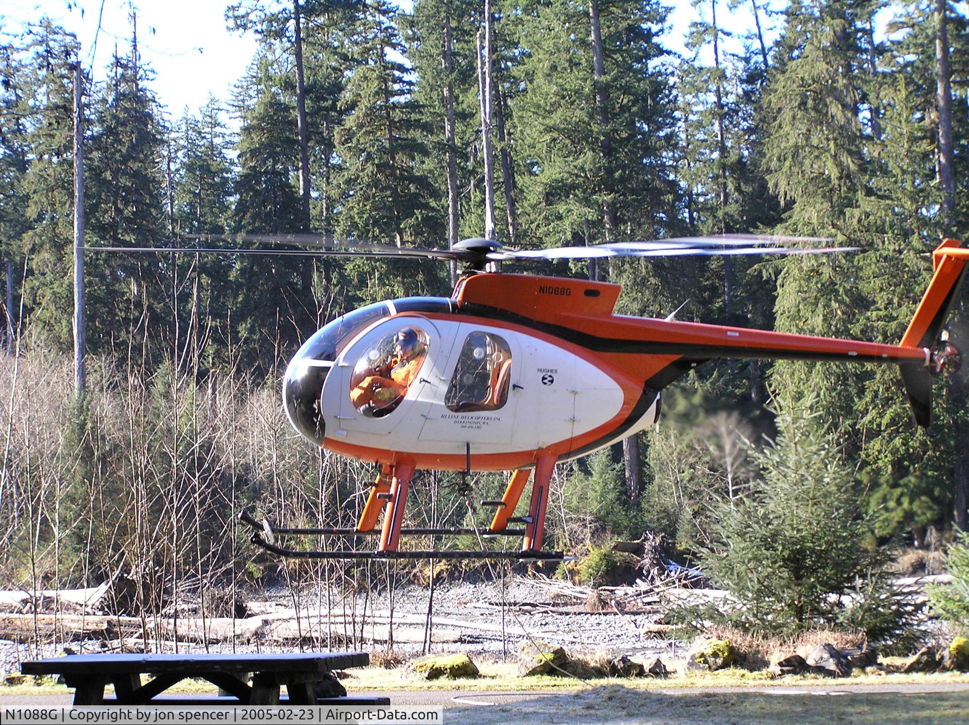 N1088G, 1980 Hughes 369D C/N 700736D, Hauling a load of gravel into the backcountry in the Hoh Rainforest near Forks Washington.