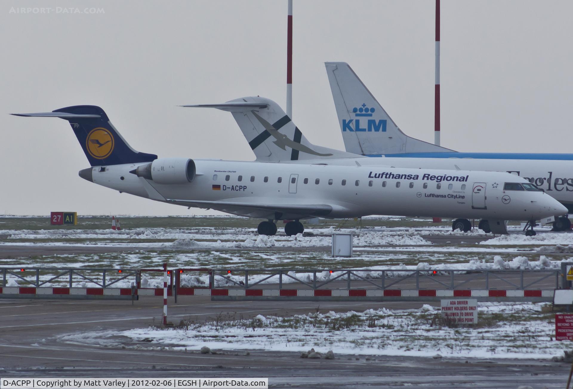 D-ACPP, 2003 Bombardier CRJ-701ER (CL-600-2C10) Regional Jet C/N 10086, Sat on stand 9 after spray by Air Livery.