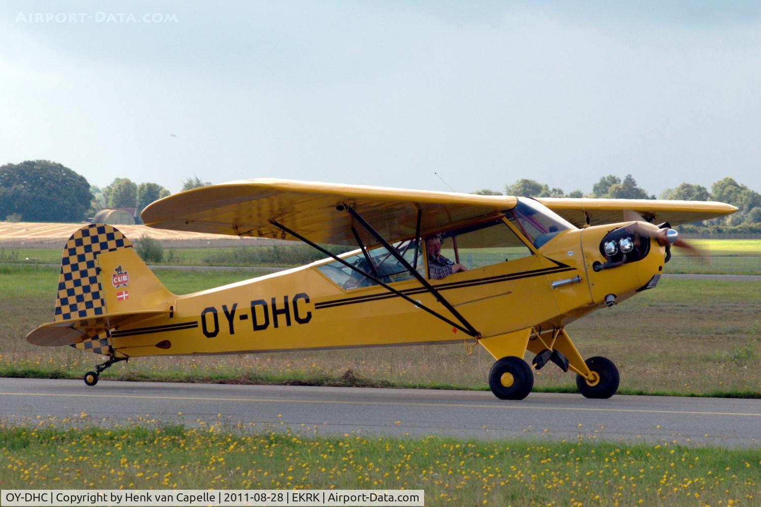 OY-DHC, 1944 Piper J3C-65 Cub Cub C/N 13173, Piper Cub taxying past at Roskilde airport, Denmark.