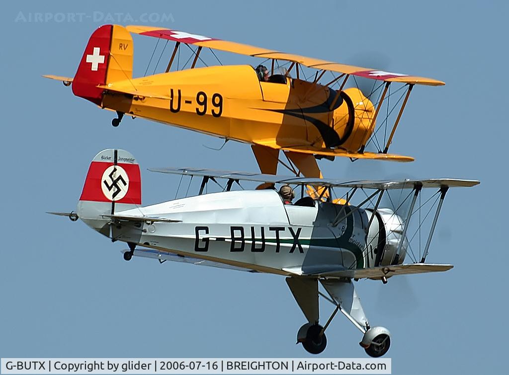 G-BUTX, 1940 Bucker Bu-133C Jungmeister C/N ES.1-4, Taff Smith flying Tango Xray and formating on G-AXMT flown by the late Brian Brown.