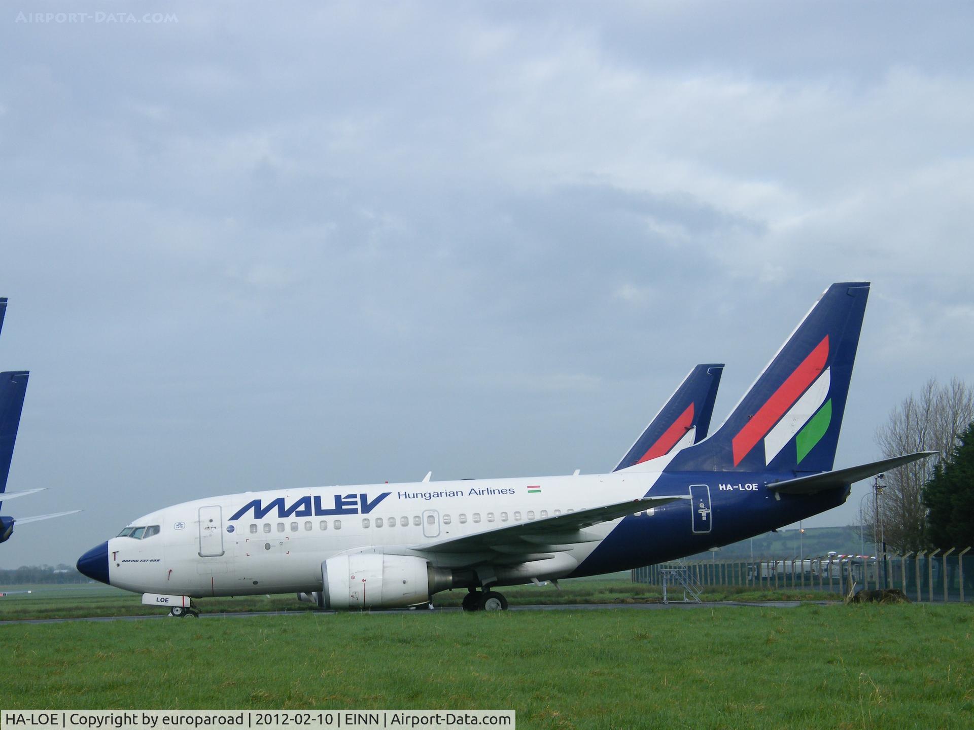 HA-LOE, 2003 Boeing 737-6Q8 C/N 28260, HA LOE parked next to aer lingus hgr 10-02-2012