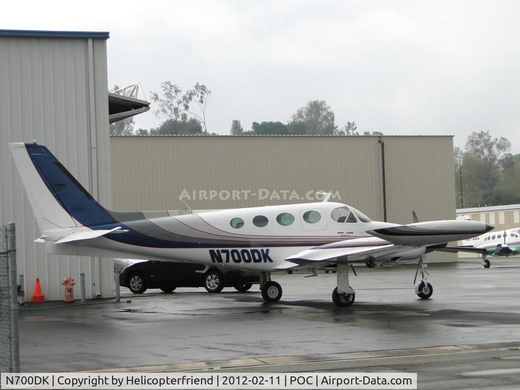 N700DK, 1980 Cessna 340A C/N 340A1038, Parked in the rain by Howard Aviation hanger