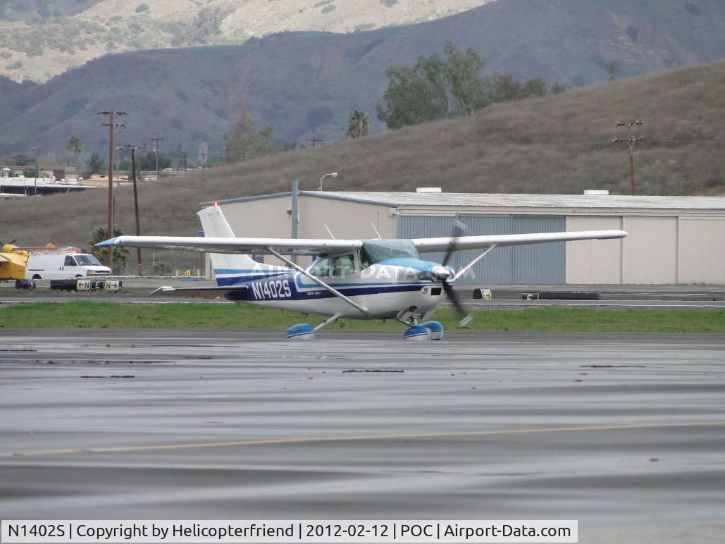N1402S, 1976 Cessna 182P Skylane C/N 18264962, Just landed on 26L and is taxiing into transient parking