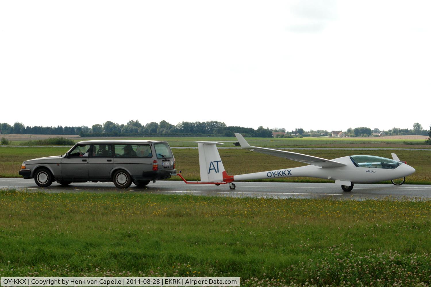 OY-KKX, 2006 Sportine Aviacija LAK-17AT C/N 185, A LAK-17AT motorglider being towed by a Volvo at Roskilde airport. This aircraft is Lithuanian designed and built and has a small retractable engine.