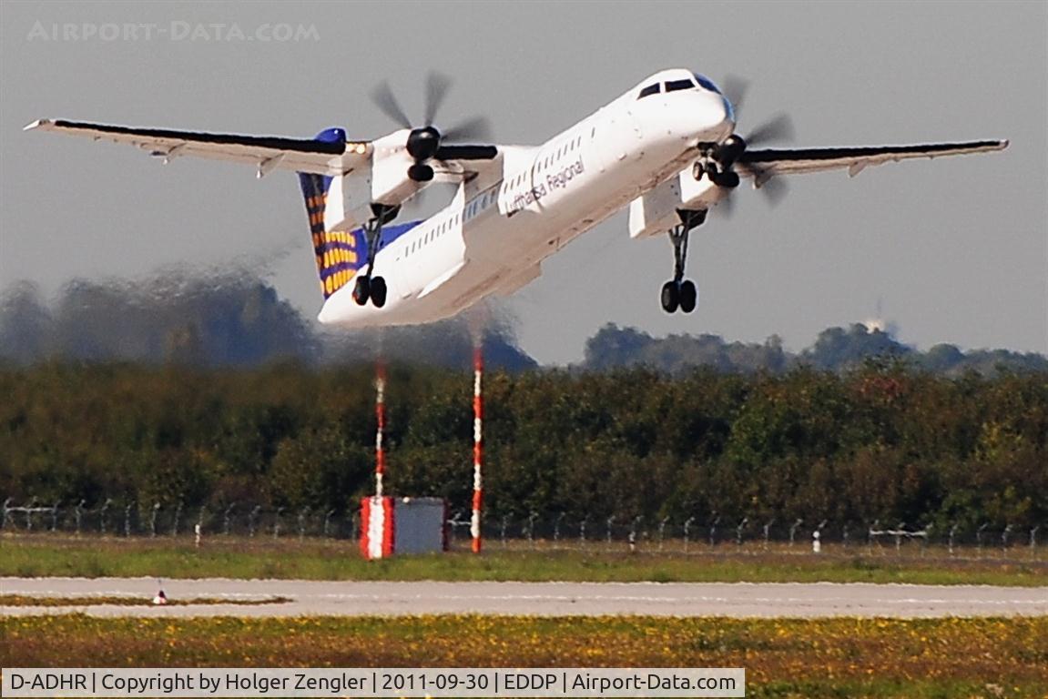 D-ADHR, 2001 De Havilland Canada DHC-8-402Q Dash 8 C/N 4041, Leaving rwy 08L on a hot september days noon....