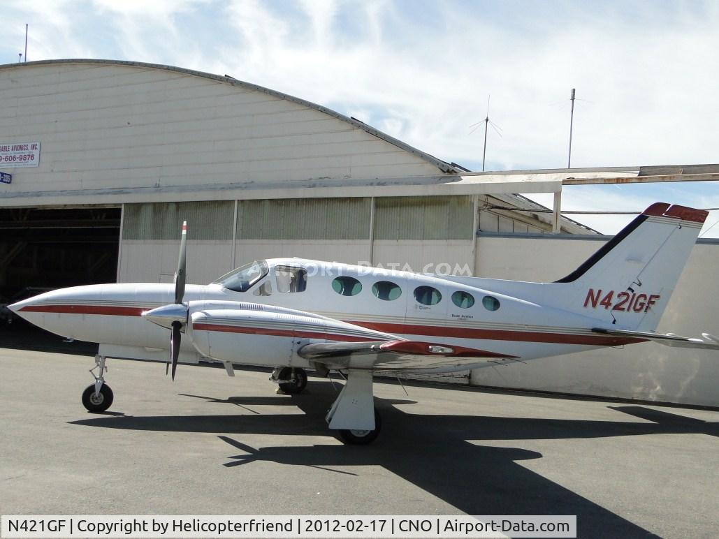 N421GF, Cessna 421C Golden Eagle C/N 421C1110, Parked by a hanger