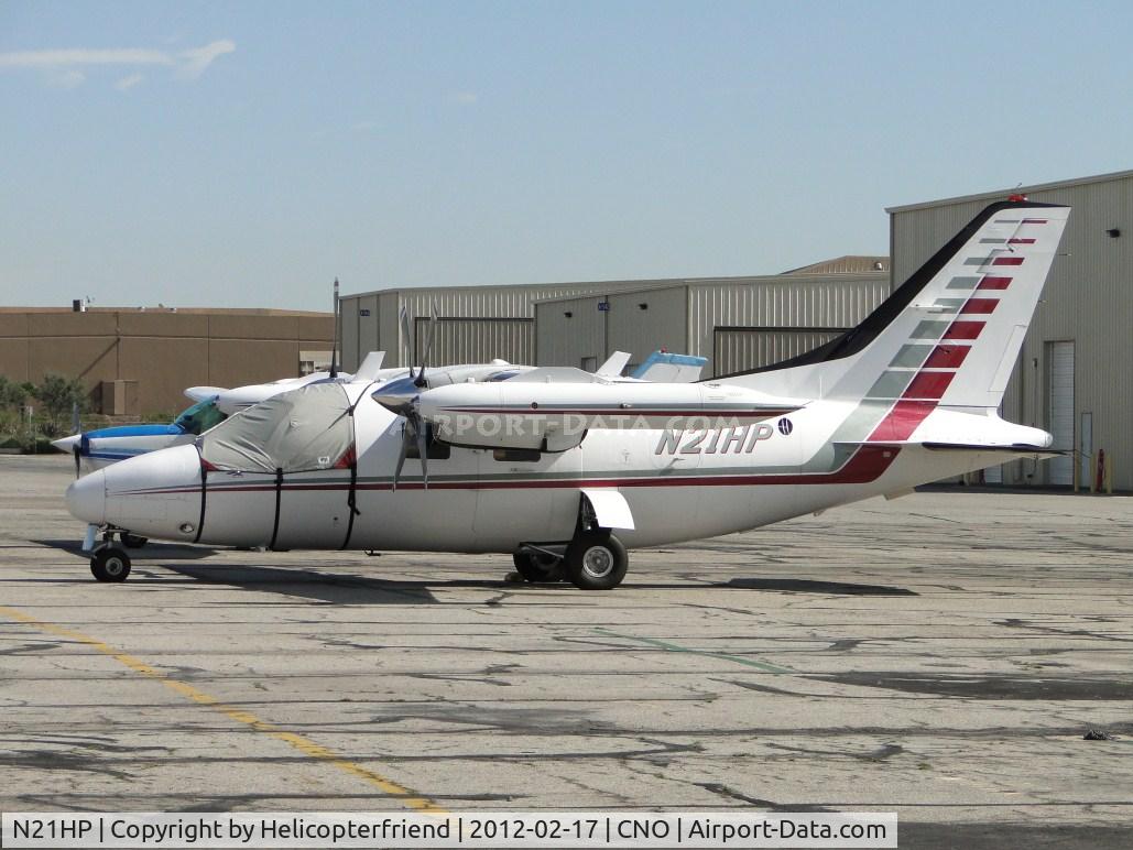 N21HP, 1977 Mitsubishi MU-2B-26A C/N 357SA, Covered and parked south of the paint shop