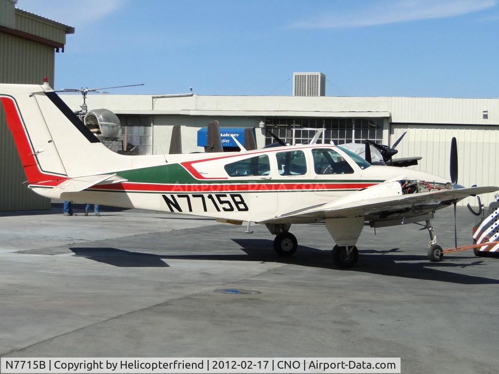 N7715B, 1968 Beech D55 Baron C/N TE-540, Being towed out from a hanger near Planes of Fame area