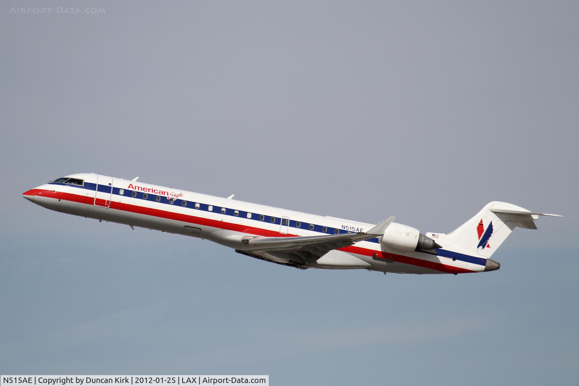 N515AE, 2003 Bombardier CRJ-701ER (CL-600-2C10) Regional Jet C/N 10121, Rising from the LA smog