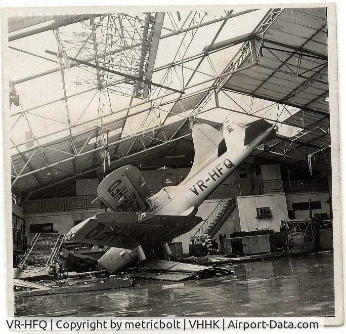 VR-HFQ, 1953 De Havilland DHC-1 Chipmunk 21 C/N C1-0944, DHC-1 Chipmunk damaged by Typhoon Wanda,1962.Stinson L-5 in background.