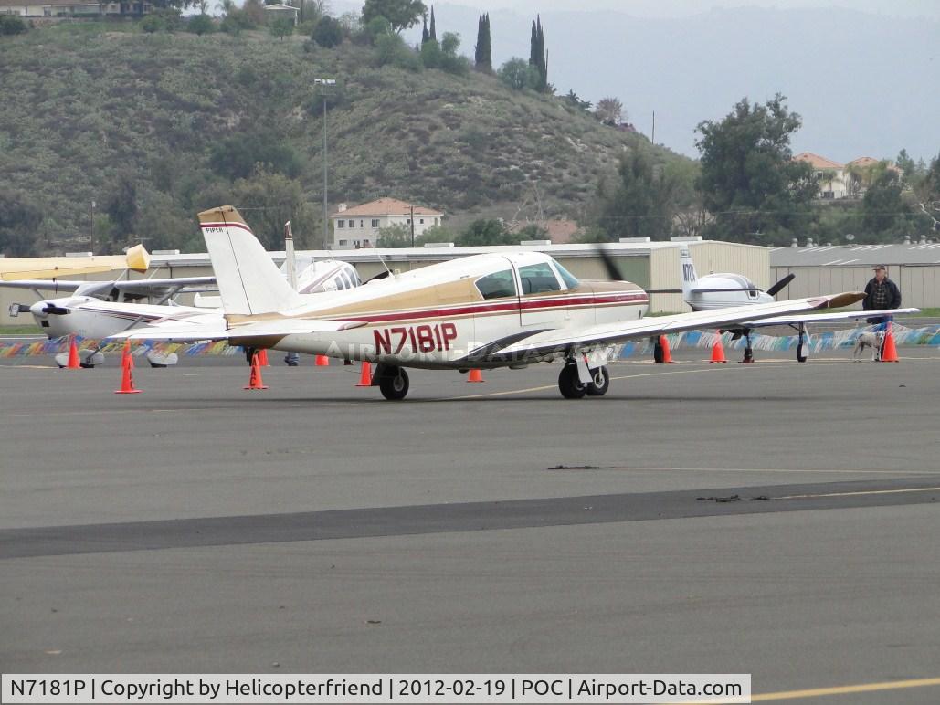 N7181P, 1960 Piper PA-24-250 Comanche C/N 24-2350, Waiting to taxi onto taxiway Sierra by the fueling station