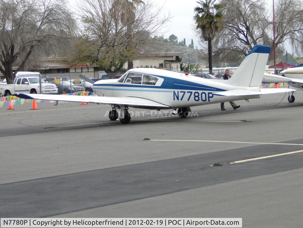 N7780P, 1961 Piper PA-24-250 Comanche C/N 24-2997, People walking up to the ship in transient parking, east of the static display area