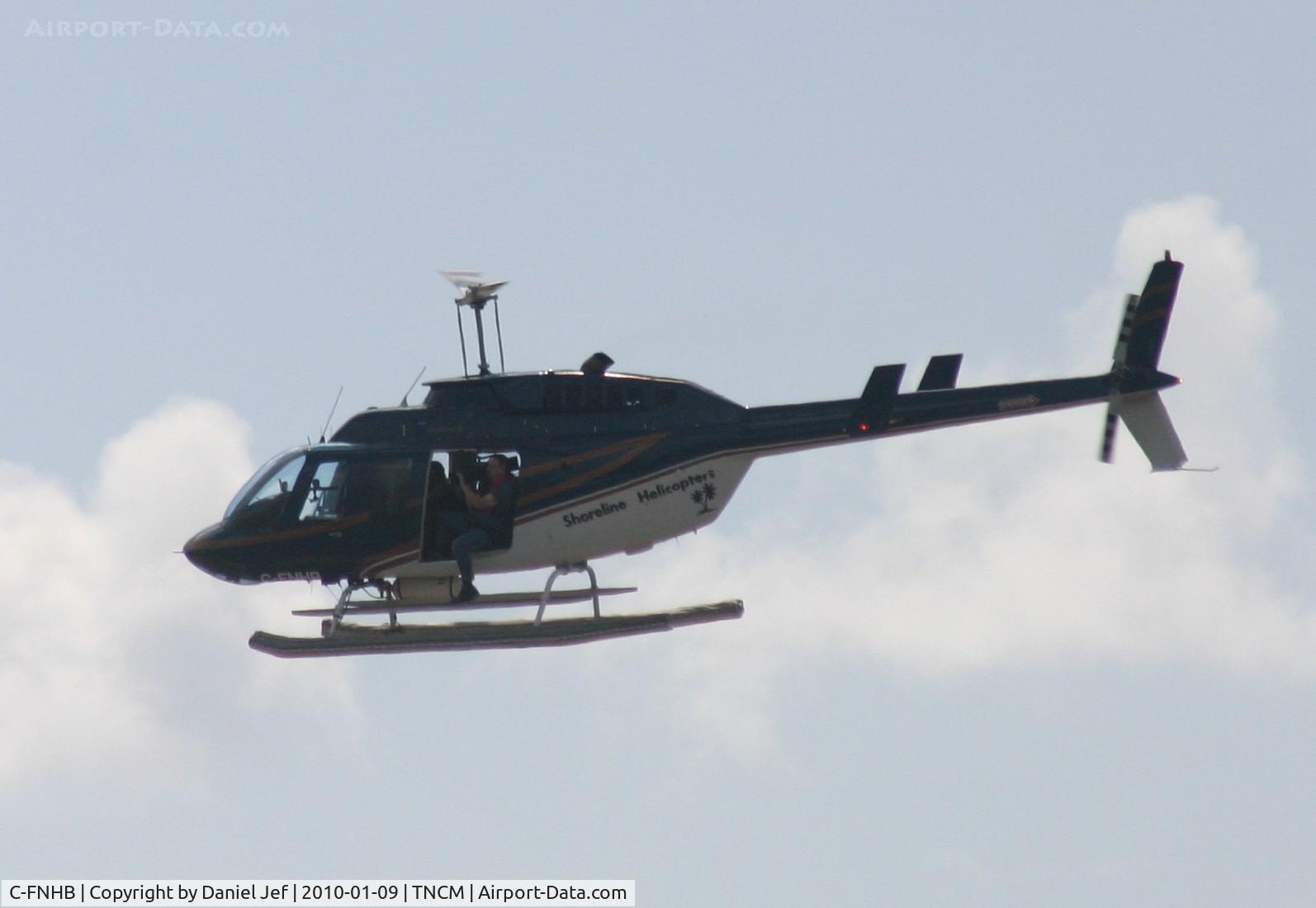C-FNHB, 1981 Bell 206L-1 LongRanger II C/N 45661, a photo crew making shots of the airport