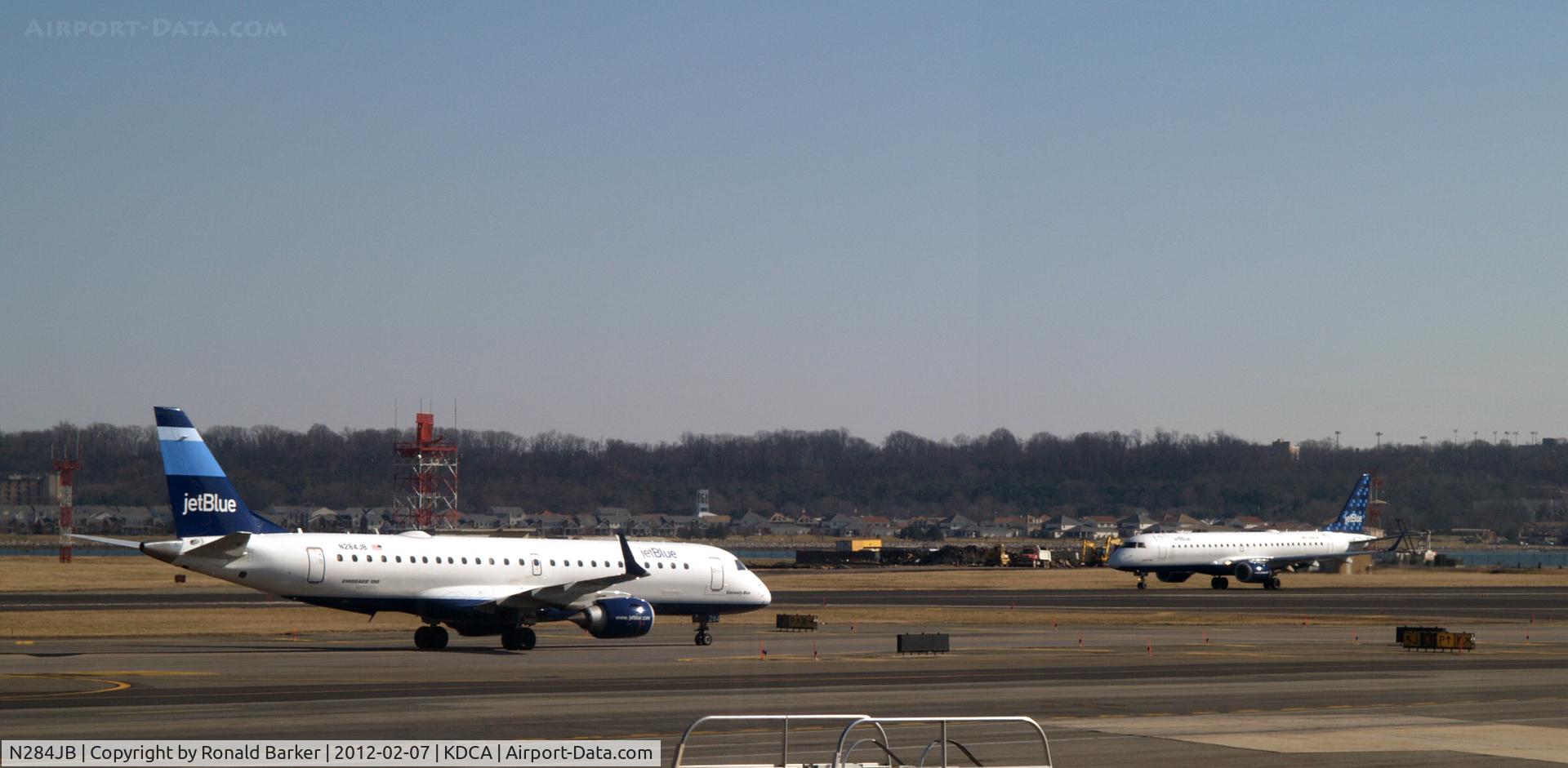 N284JB, 2008 Embraer 190AR (ERJ-190-100IGW) C/N 19000144, N284JB taxi to parking and N281JB take off