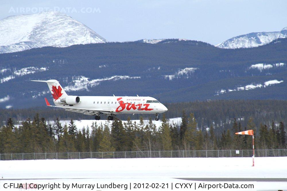 C-FIJA, 2004 Bombardier CRJ-200ER (CL-600-2B19) C/N 7987, Landing in a 20-knot headwind.
