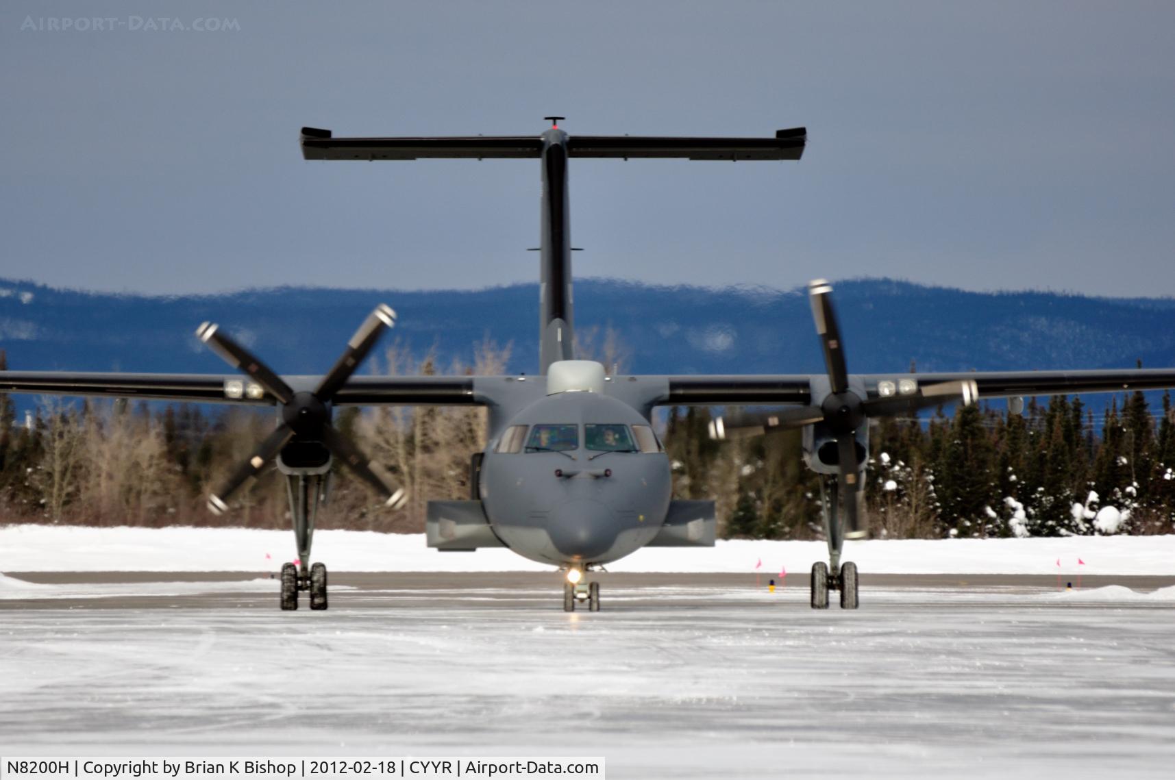 N8200H, 1997 De Havilland Canada DHC-8-202 Dash 8 C/N 494, taxiing off rwy08