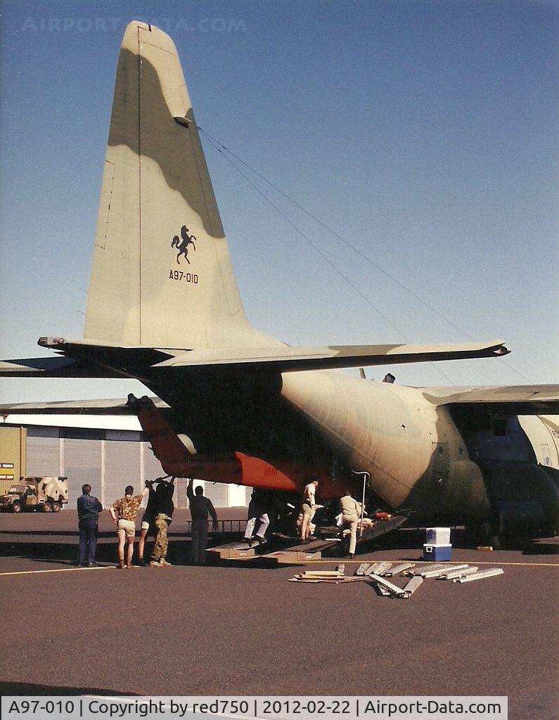 A97-010, 1978 Lockheed C-130H Hercules C/N 382-4790, Photograph by Edwin van Opstal with permission. Scanned from a color print. Loading an Iriquois for transport to Bougainville during the rebel uprising.
