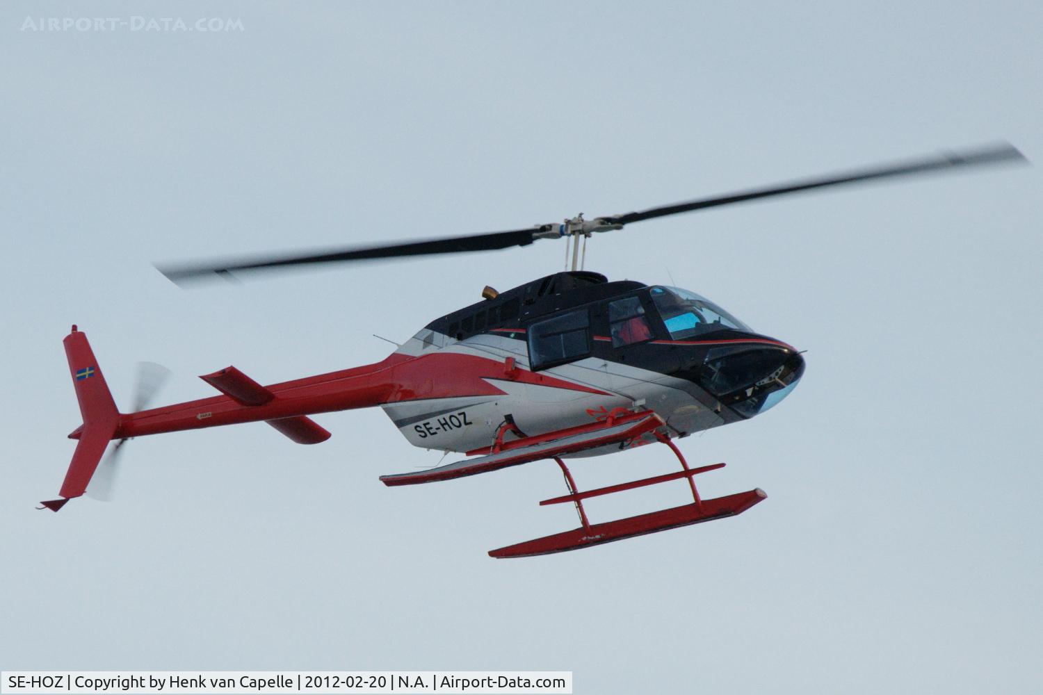 SE-HOZ, 1975 Bell 206B C/N 1827, Bell 206B about to land at Björkvik ferry landing on Ingarö island near Stockholm in Sweden.