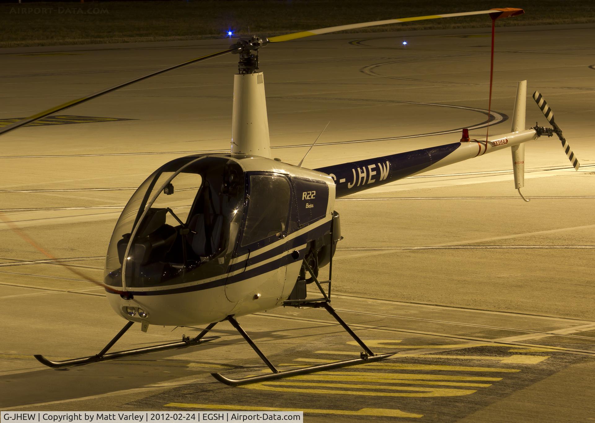 G-JHEW, 1987 Robinson R22 Beta C/N 0672, sat under the floodlights at SaxonAir.