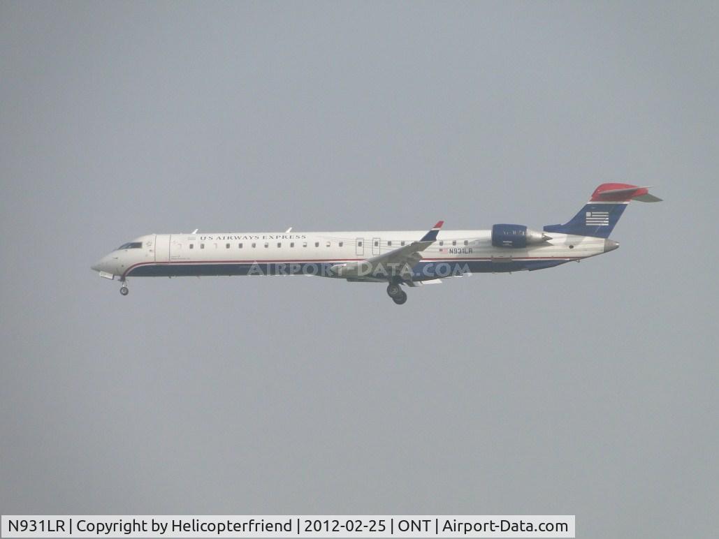 N931LR, 2005 Bombardier CRJ-900ER (CL-600-2D24) C/N 15031, Broke through the clouds
