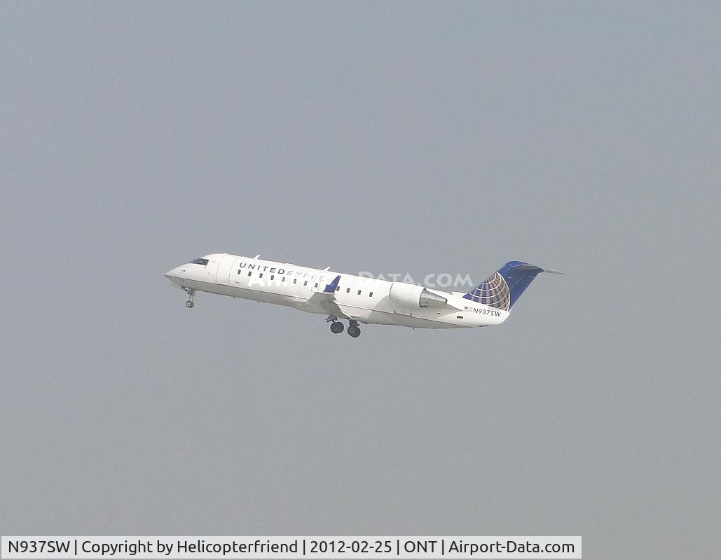 N937SW, 2003 Bombardier CRJ-200LR (CL-600-2B19) C/N 7735, Passengers on board and headed west from 26R