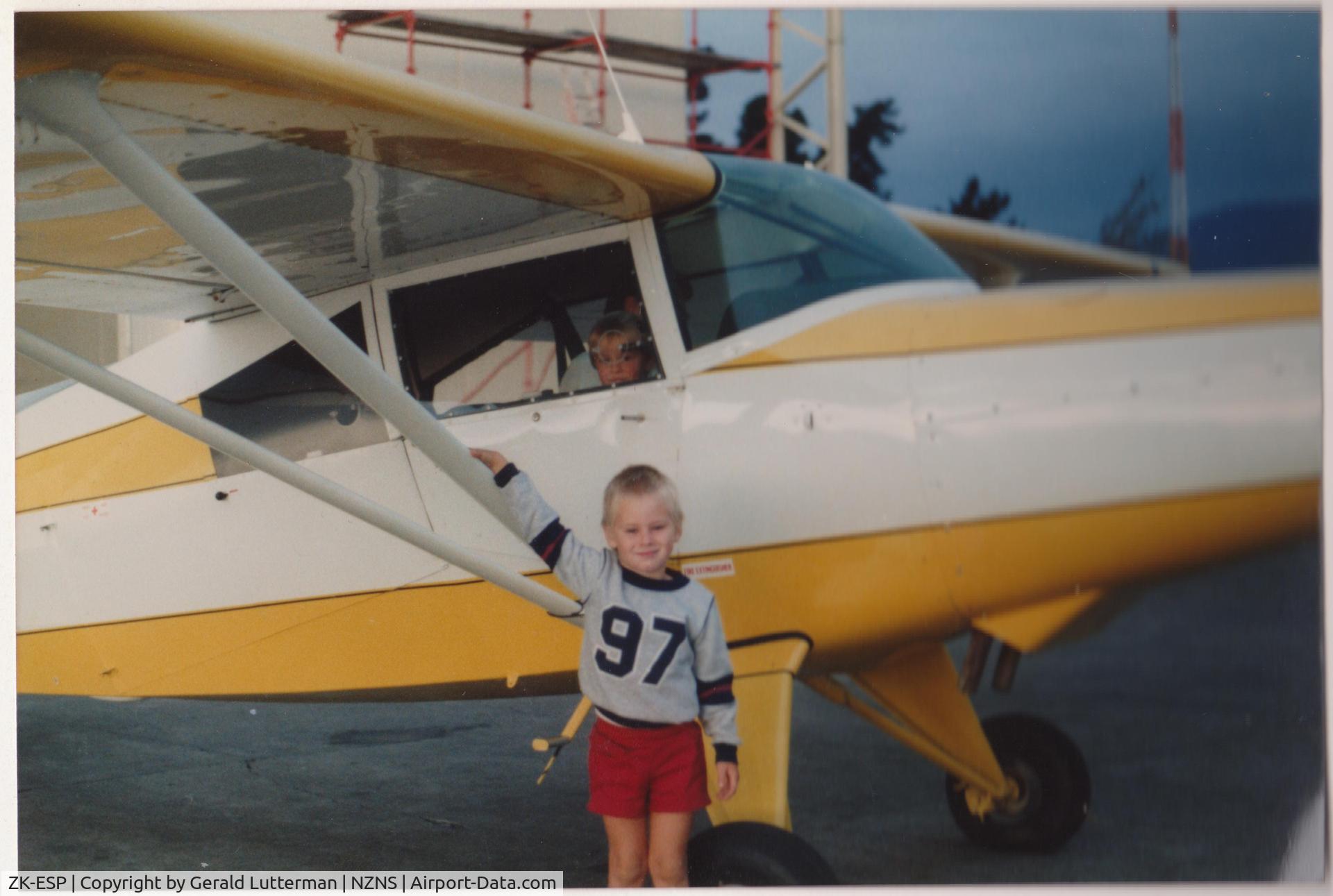 ZK-ESP, Maule M-5-180C C/N 8016C, Child looking out window from copilot's seat is now C-5 pilot in USAF. Taken in 1984