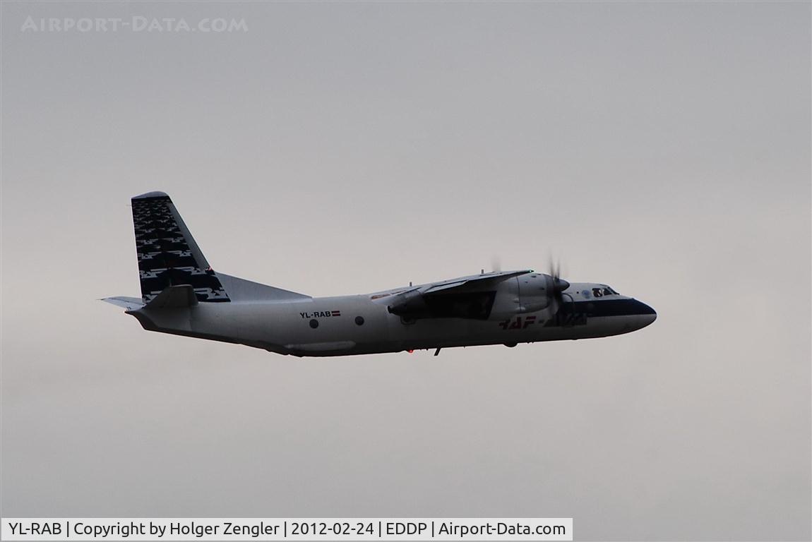 YL-RAB, 1980 Antonov An-26B C/N 7310508, Yesterdays last departs today minutes before tomorrows first freighters turn in for landing on rwy 26L.