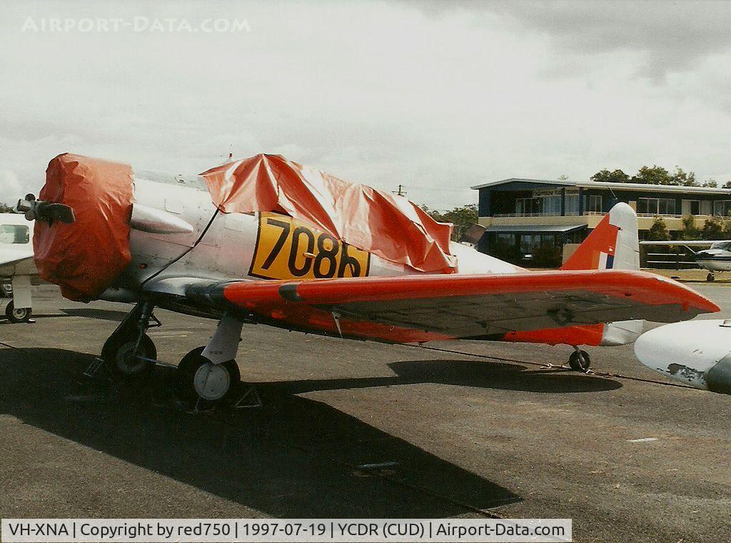 VH-XNA, 1942 North American AT-6C Harvard IIA C/N 88-9754, Photograph by Edwin van Opstal with permission. Scanned from a color print. Photograhed at Caloundra, Qld (CUD)