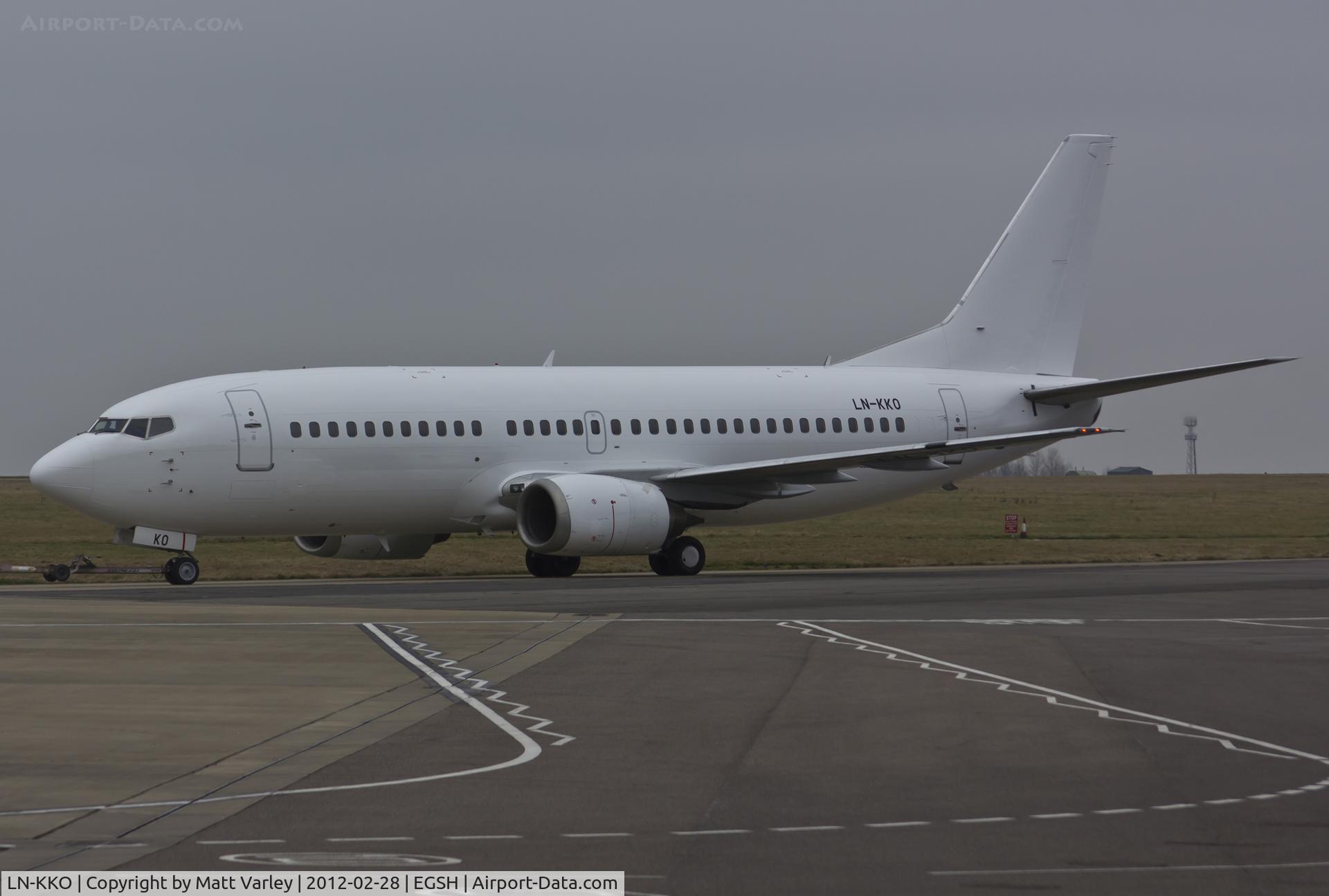LN-KKO, 1991 Boeing 737-3Y0 C/N 24909, Being towed to stand 8 after spray into an all white C/S.