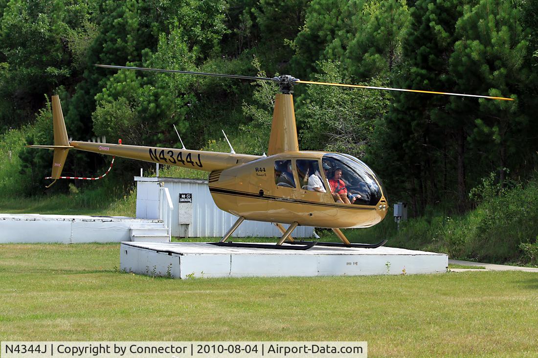 N4344J, 2009 Robinson R44 II C/N 12818, This beautiful gold coloured Raven II is preparing for another scenic trip through the Black Hills Area.