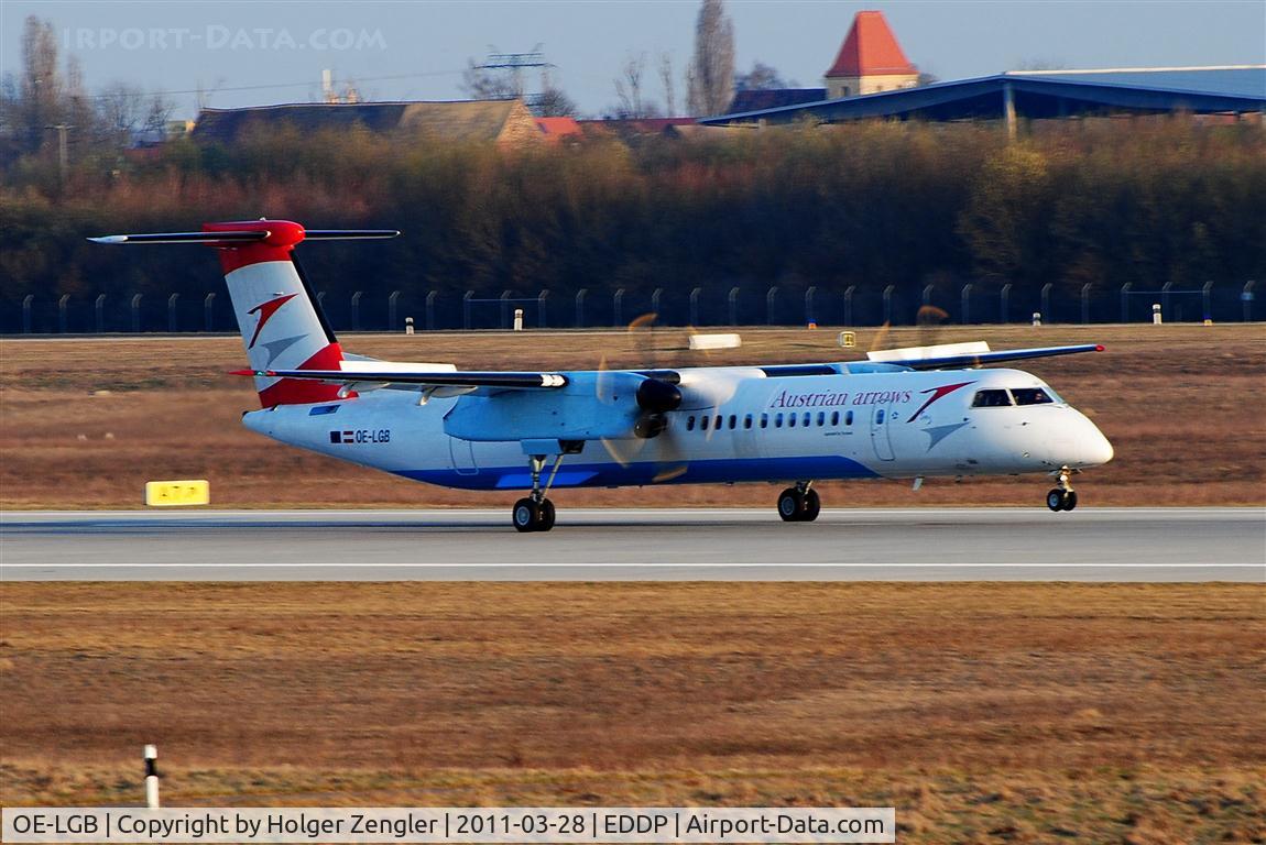 OE-LGB, 1999 De Havilland Canada DHC-8-402Q Dash 8 C/N 4015, Touch down on rwy 26R in mild evening sunlight.....
