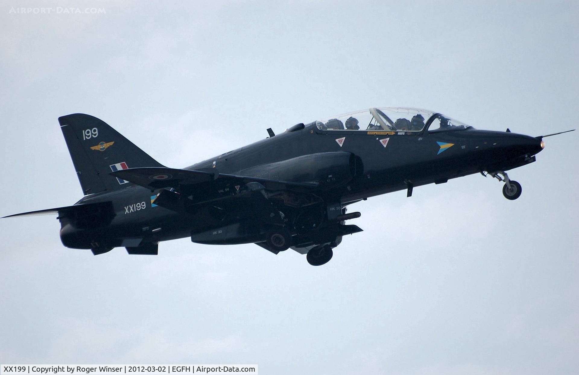 XX199, 1978 Hawker Siddeley Hawk T.1A C/N 046/312046, Coded 199 of 208(Reserve) Squadron RAF. Seen climbing out after a practice approach to Runway 04.