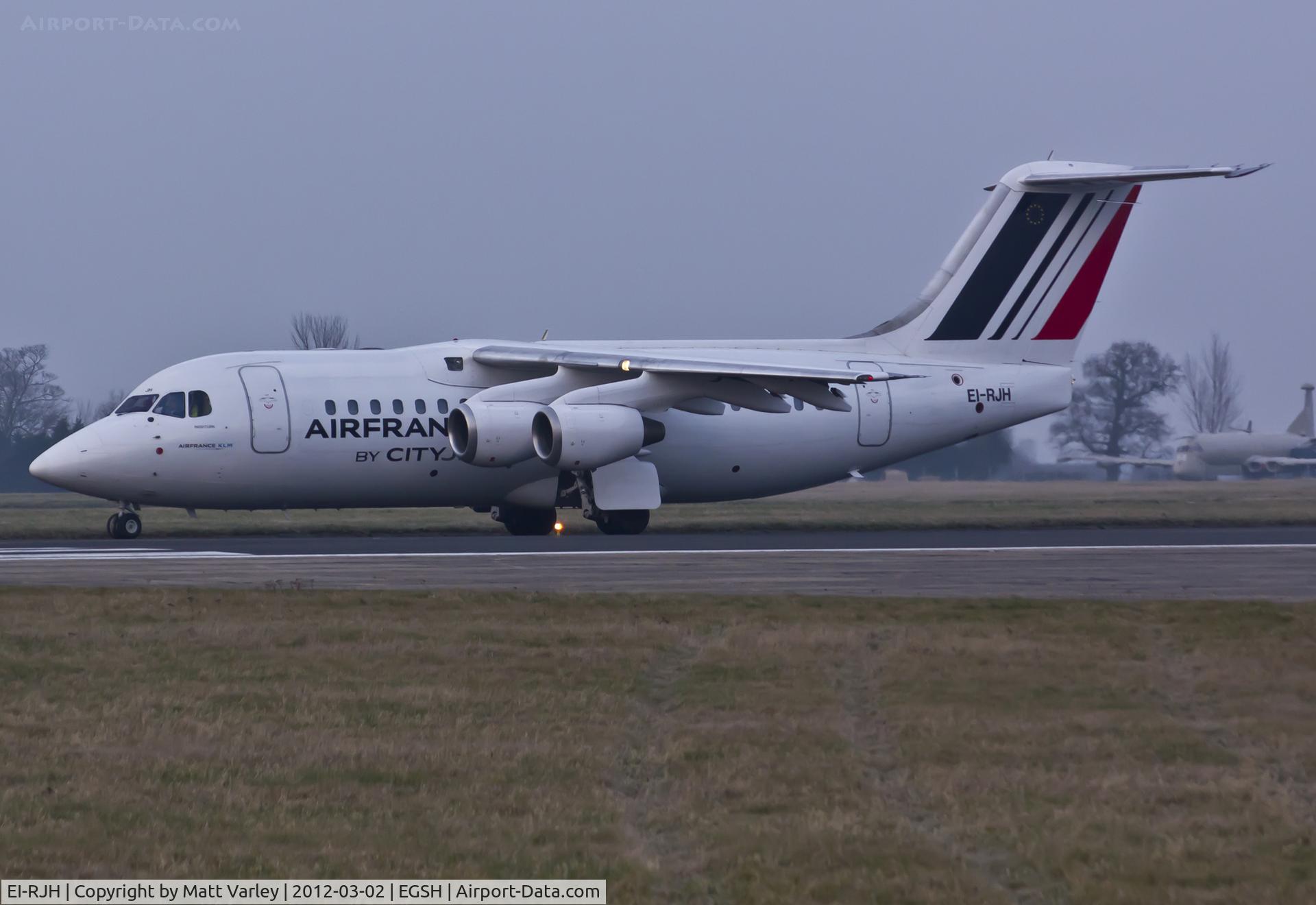 EI-RJH, 1999 BAE Systems Avro 146-RJ85 C/N E.2345, Departing EGSH after the sun had set.