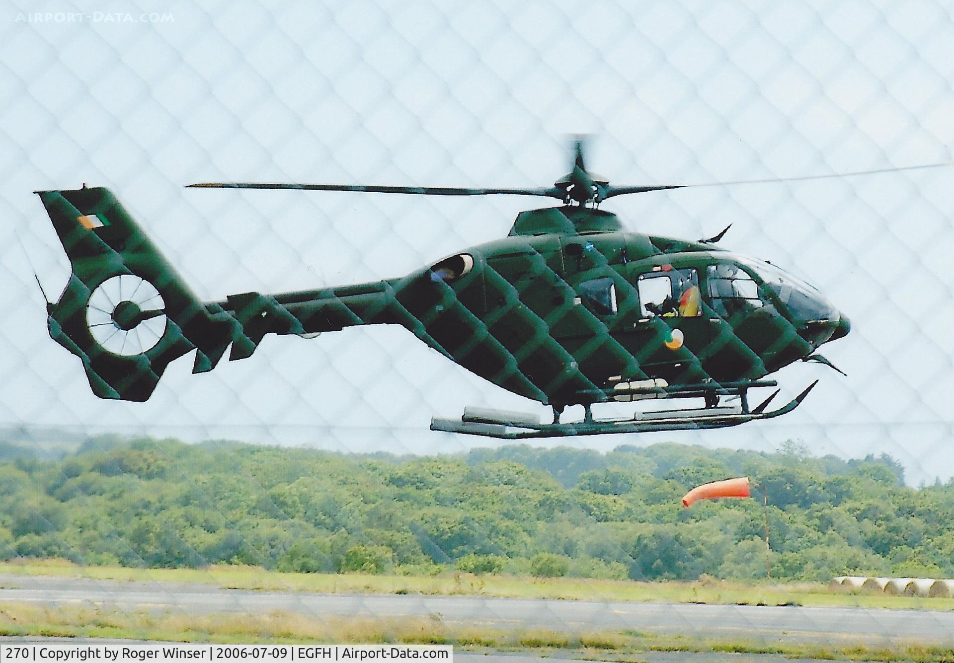 270, Eurocopter EC-135P-2+ C/N 0425, Through the fence. Operated by 302 Squadron Irish Air Corps. Departing after a brief visit. Was on static display at the RNAS Yeovilton Air Day the previous day.