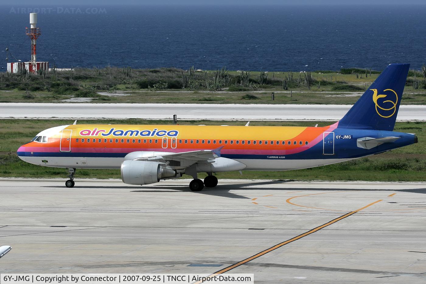 6Y-JMG, 2001 Airbus A320-214 C/N 1390, Colourfull bird on a colourfull island.