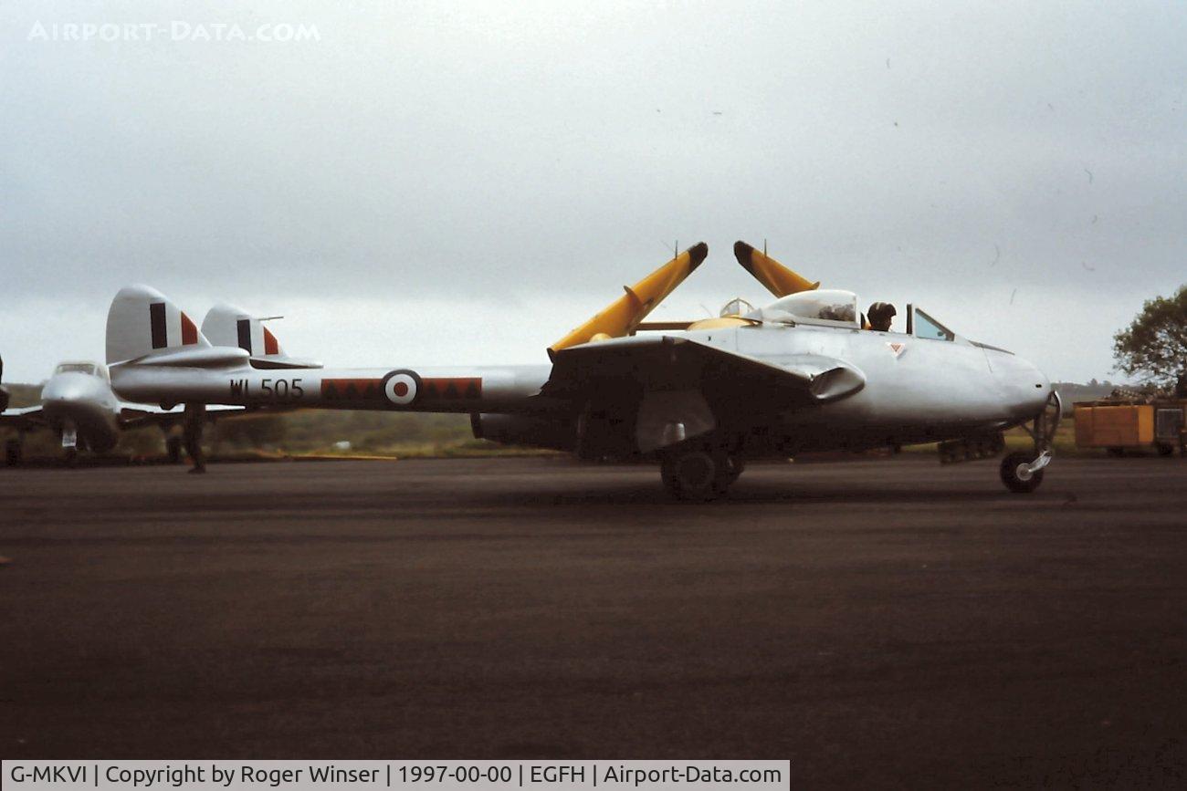 G-MKVI, 1953 De Havilland (FFA) Vampire FB6 (DH-100) C/N 676, Was J-1167 in the Swiss Air Force. Part of DHA's collection at Swansea Airport. Seen taxying past thier Vampire T.55 and Sea Vixen FAW.2 during a Wings Over Wales open day in 1997.