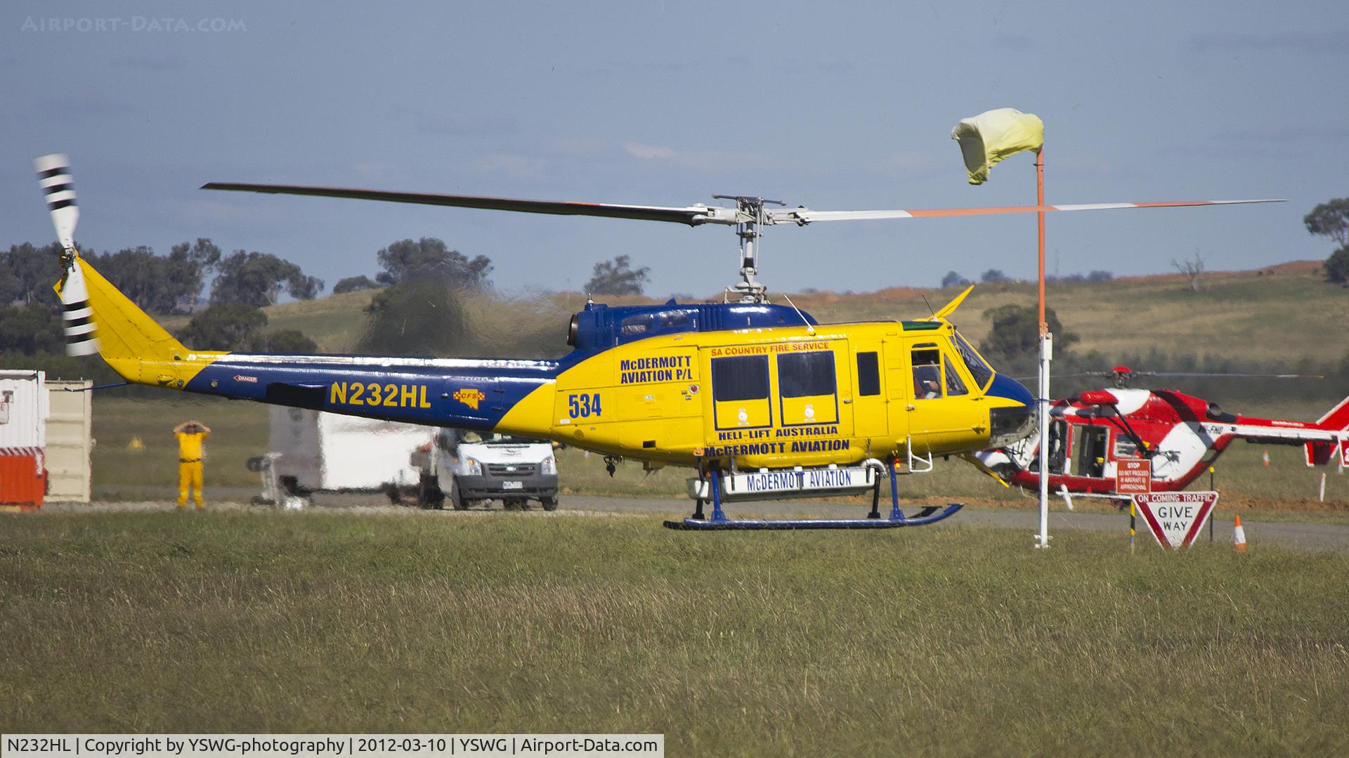 N232HL, 1974 Bell 205A-1 C/N 30157, Bell 205A-1 Super Huey landing at Wagga Wagga Airport after completing flood operations.