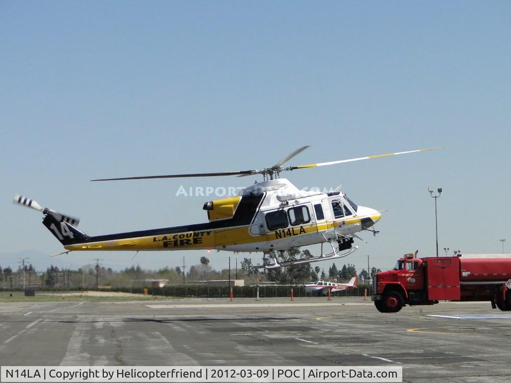 N14LA, 2005 Bell 412EP C/N 36393, Getting ready to turn around and re-fuel hot, appeared to be working on a call out