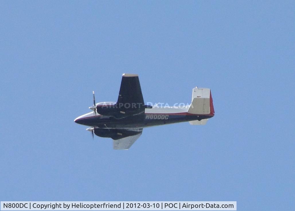 N800DC, 1956 Beech D50 Twin Bonanza C/N DH-120, Flying high over the runways westbound after receiving clearence