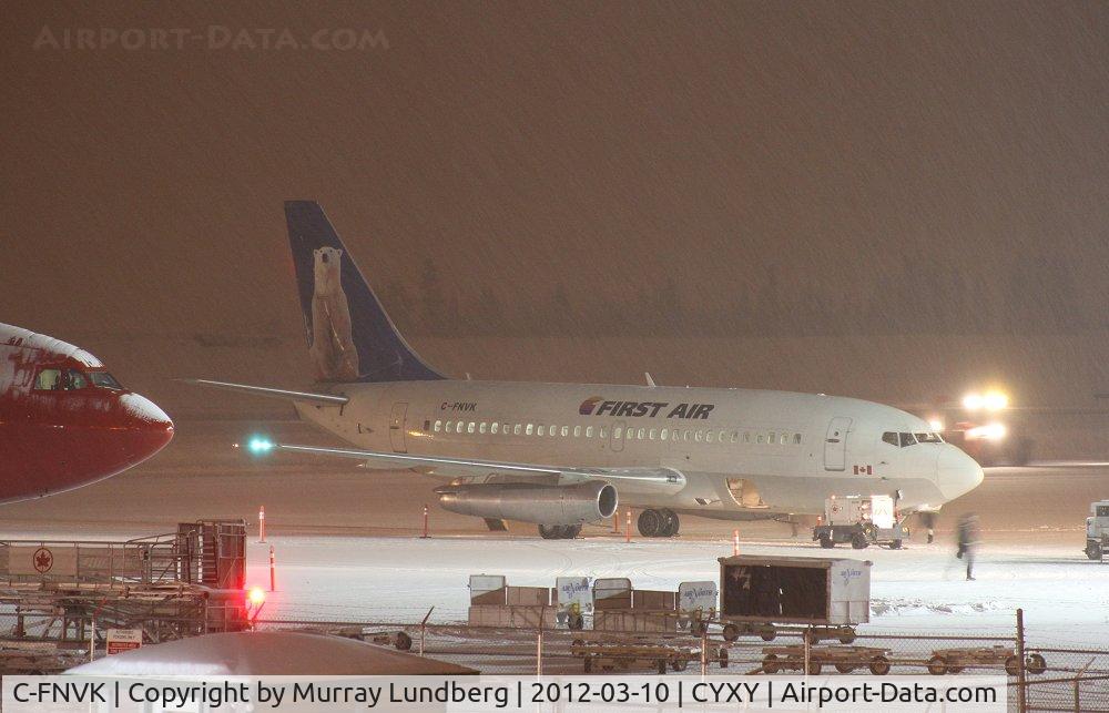 C-FNVK, 1984 Boeing 737-2R4C C/N 23130, Getting ready to load Arctic Winter Games teams on a snowy night in Whitehorse.