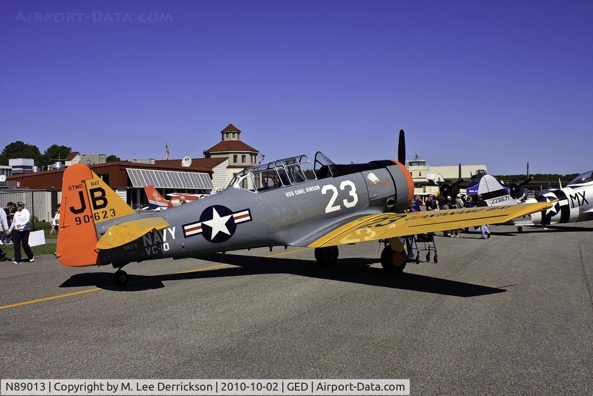 N89013, 1944 North American SNJ-5 Texan C/N 90623, Terminal is in the background behind this SNJ-5 at the Wings & Wheels Show in 2010.