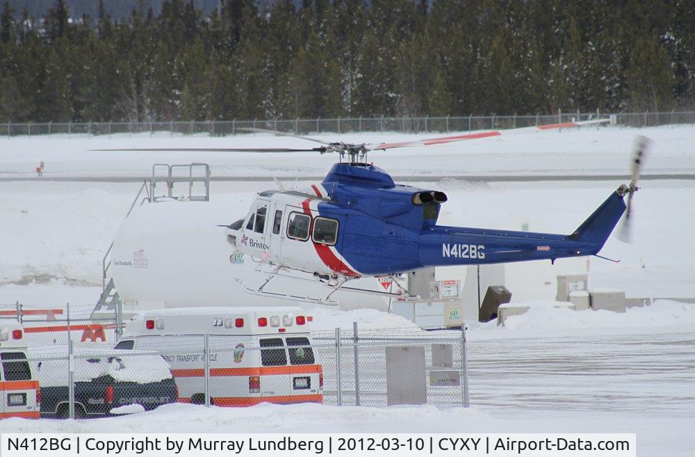 N412BG, 1990 Bell 412 C/N 33210, Landing for fuel at Whitehorse while en route to a job in Alaska.