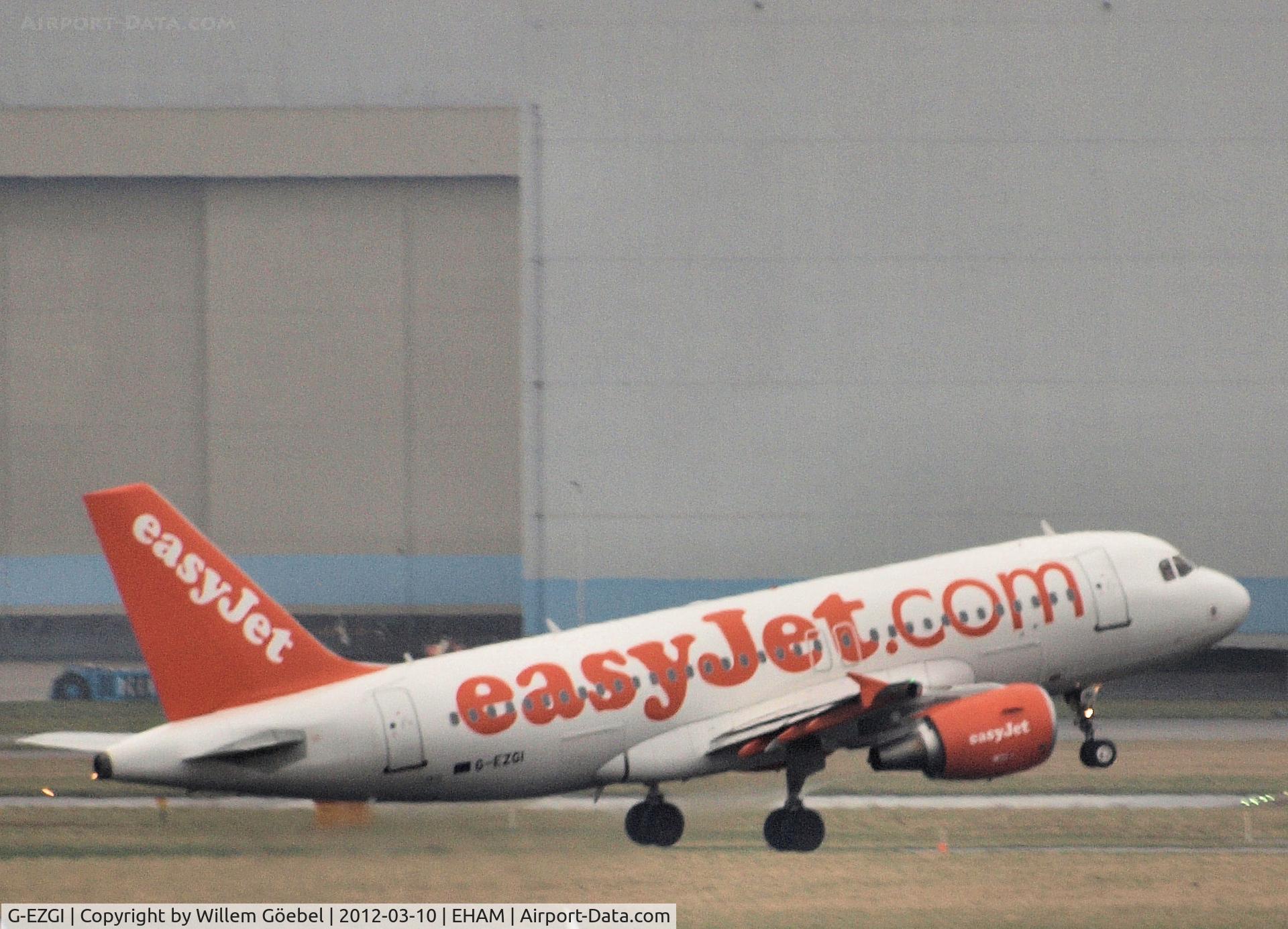 G-EZGI, 2011 Airbus A319-111 C/N 4693, Take off from runway L18 of Schiphol Airport