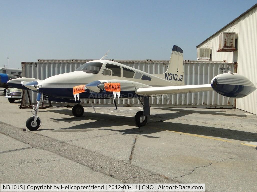 N310JS, 1957 Cessna 310B C/N 35549, Parked in a corner with 