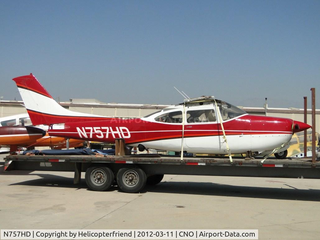 N757HD, 1979 Cessna R182 Skylane RG C/N R18201231, Trucked in and still tied down on a trailer