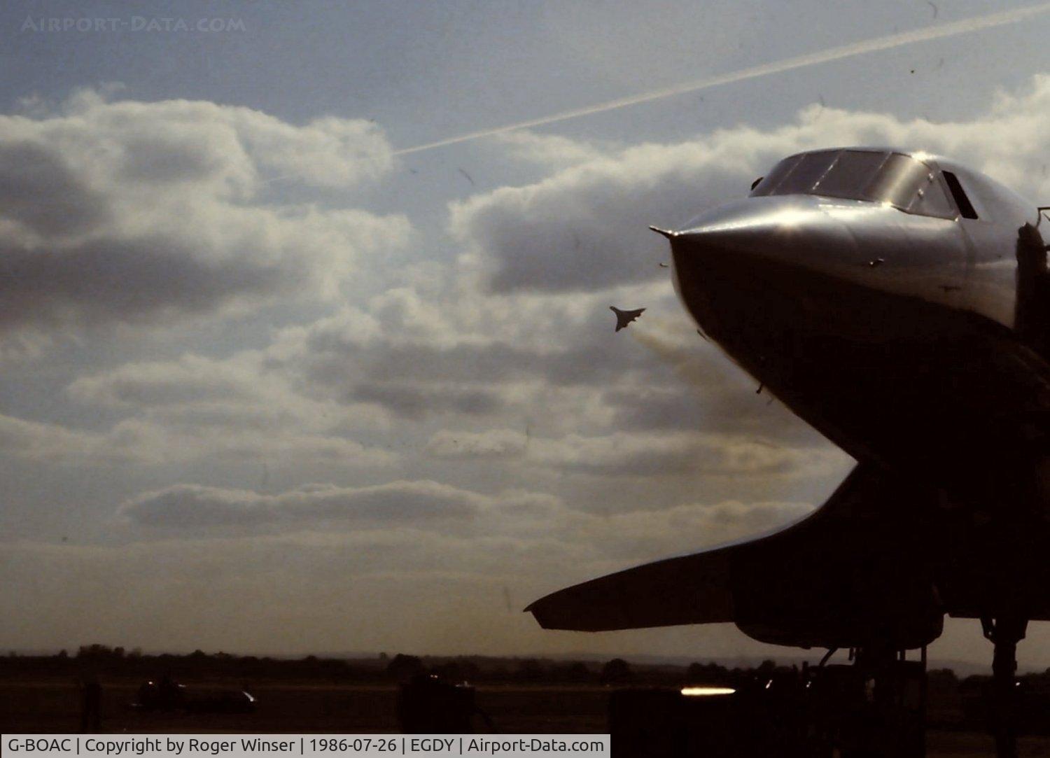 G-BOAC, 1975 Aerospatiale-BAC Concorde 1-102 C/N 100-004, BA Concorde aircraft G-BOAC flying over BA Concorde G-BOAA during the 1986 RNAS Yeovilton Air Day.