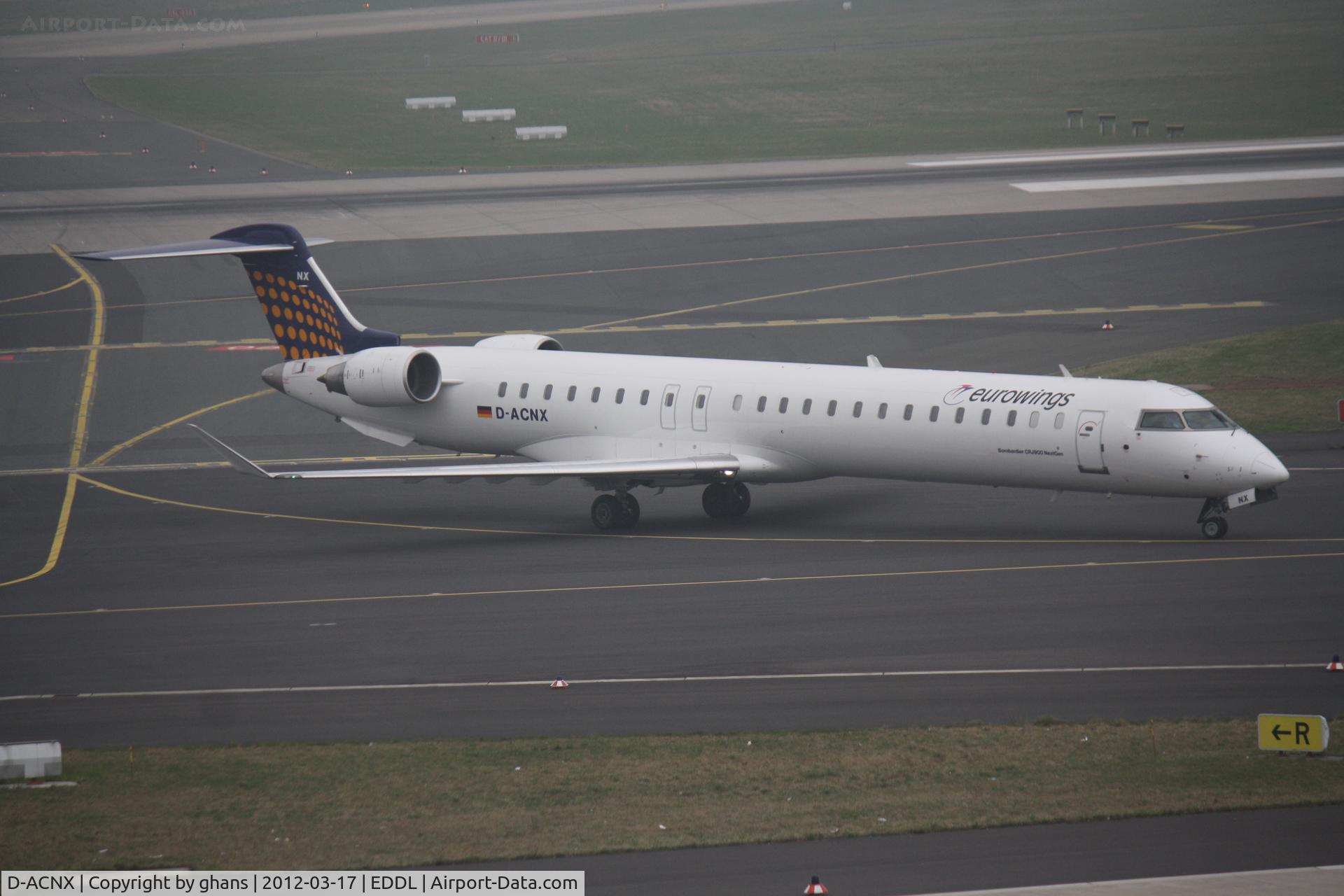 D-ACNX, 2011 Bombardier CRJ-900 NG (CL-600-2D24) C/N 15270, Vacating rw23L