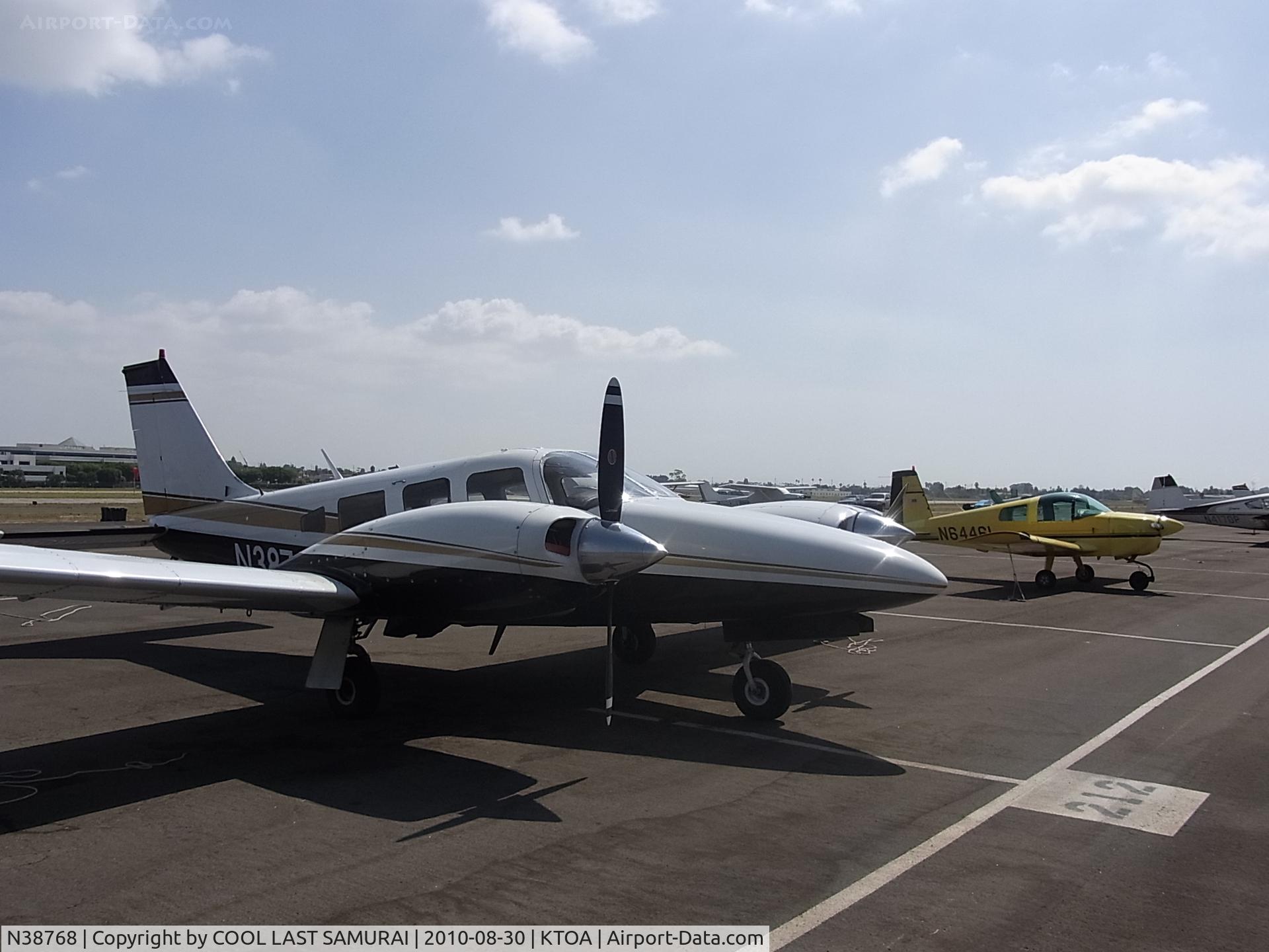 N38768, 1977 Piper PA-34-200T Seneca II C/N 34-7770085, Piper Seneca II, N38768, parked at TOA Transient parking, right next to Grumman AA1A, N6446L.